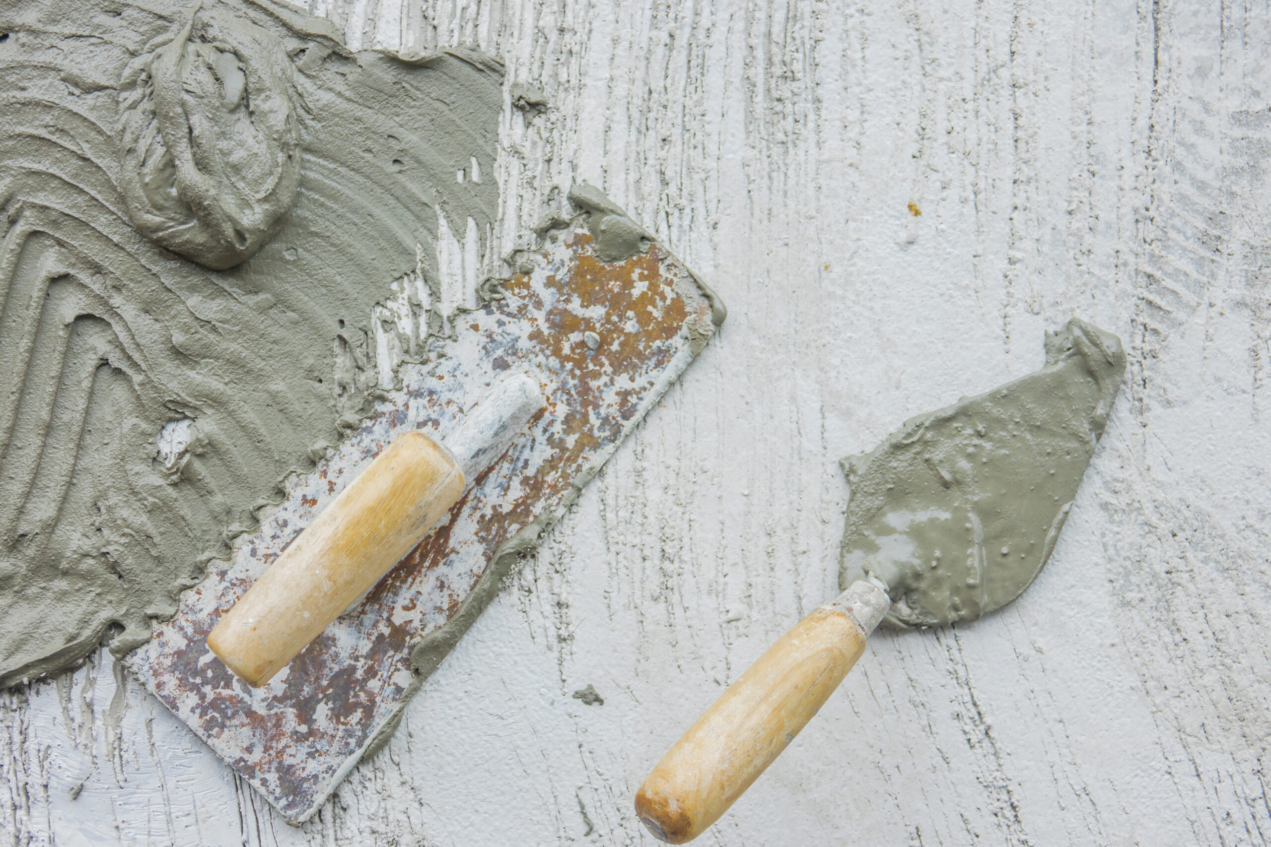 plasterer concrete worker at ground of home
